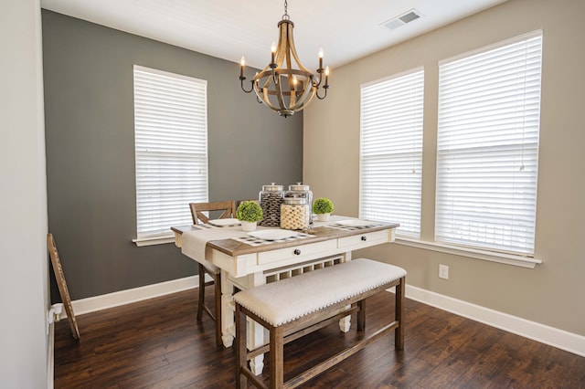 dining area featuring dark wood-type flooring and a wealth of natural light