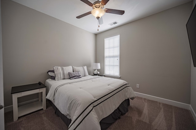 bedroom with dark carpet and ceiling fan