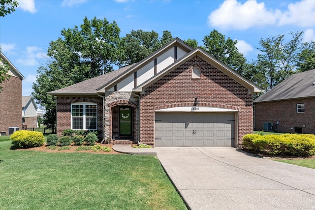 view of front of property featuring central AC, a front yard, and a garage