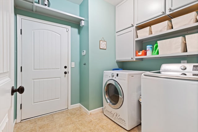 laundry area with separate washer and dryer, cabinets, and light tile flooring