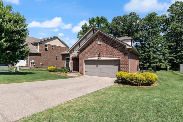 view of front of home featuring a front yard and a garage