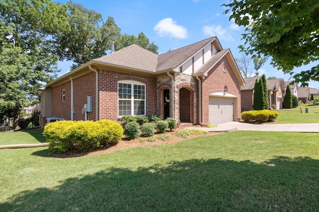 view of front of home featuring a front lawn and a garage