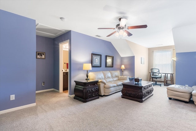 living room with ceiling fan, light colored carpet, and vaulted ceiling