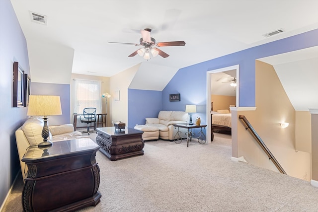 carpeted living room featuring ceiling fan and lofted ceiling