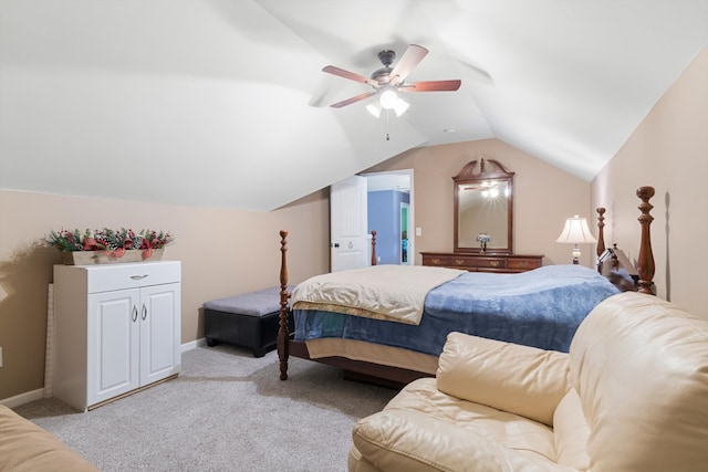 bedroom with light carpet, vaulted ceiling, and ceiling fan