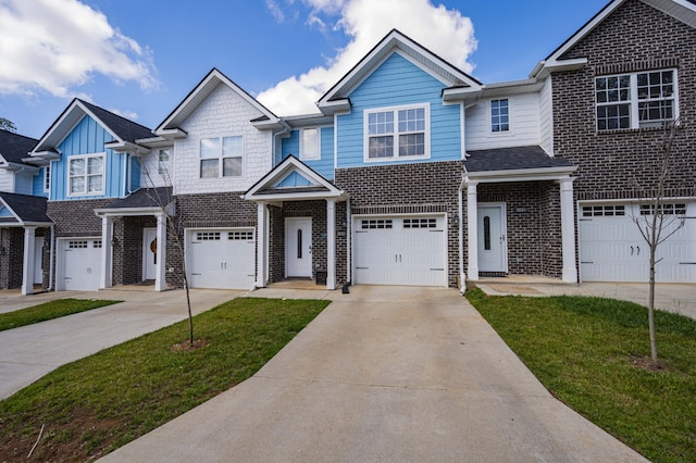 multi unit property featuring a front yard and a garage