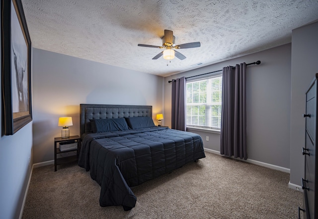 bedroom with dark carpet, ceiling fan, and a textured ceiling