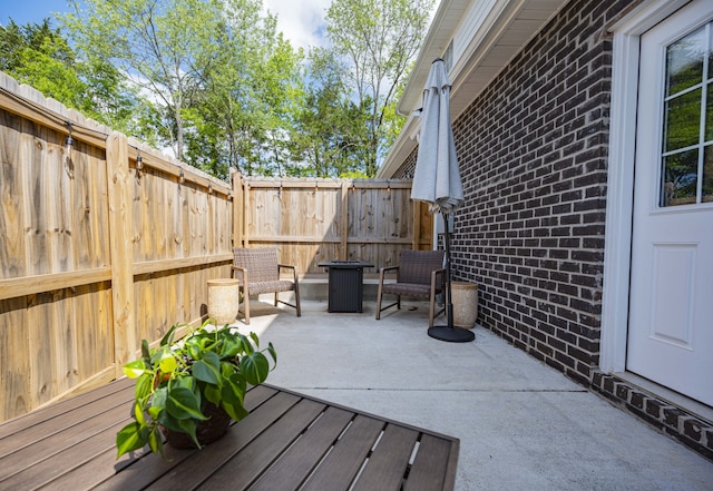 wooden deck with a patio area