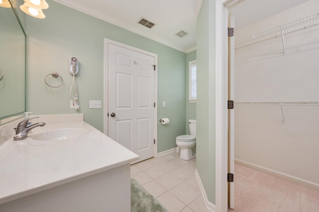 bathroom with crown molding, toilet, vanity, and tile flooring