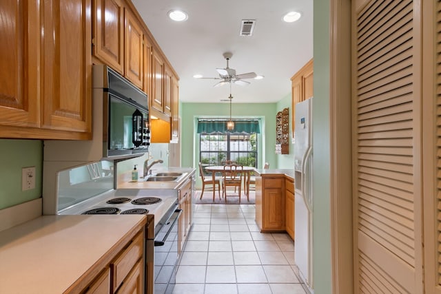 kitchen featuring light tile floors, sink, ceiling fan, white appliances, and hanging light fixtures