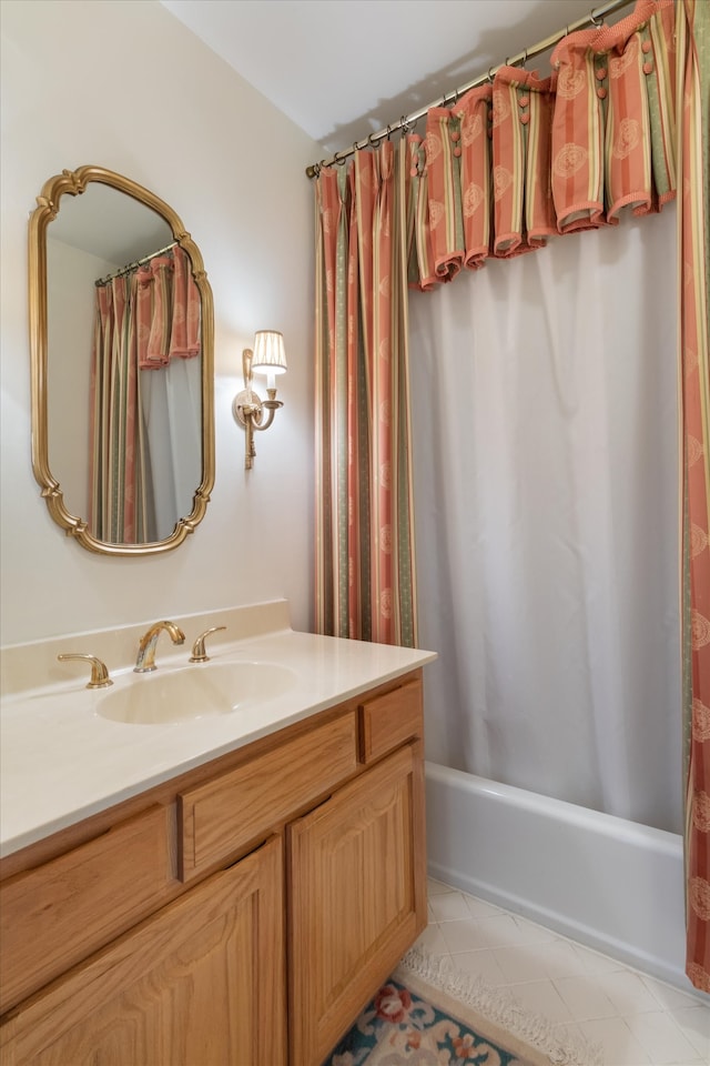 bathroom featuring tile floors, vanity, and shower / bath combo with shower curtain