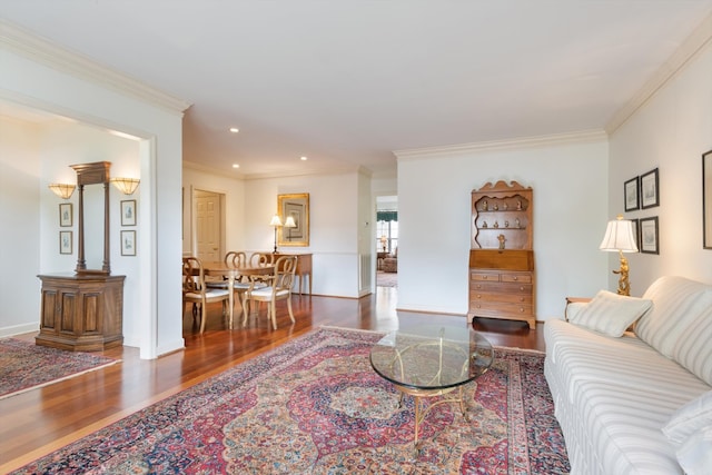 living room with ornamental molding and dark hardwood / wood-style flooring