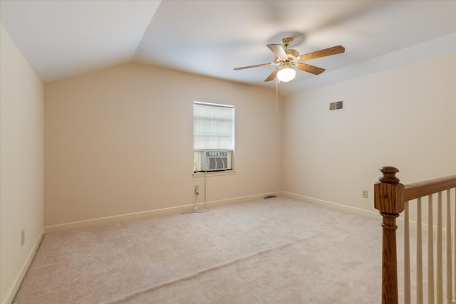 carpeted empty room with ceiling fan and lofted ceiling