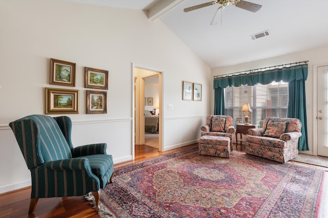 sitting room featuring high vaulted ceiling, beam ceiling, ceiling fan, and dark wood-type flooring