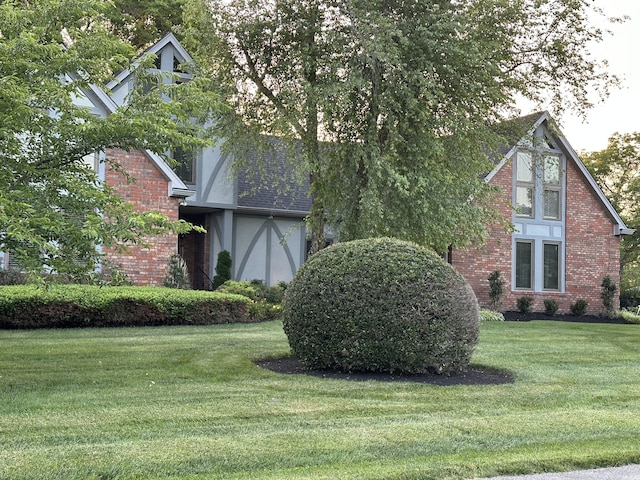 view of property exterior with a lawn