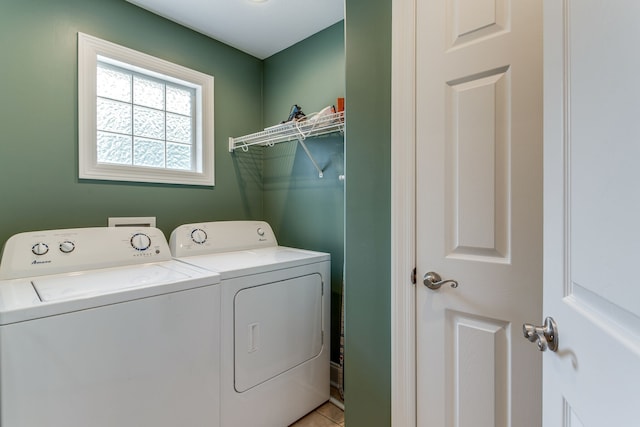 laundry area with independent washer and dryer