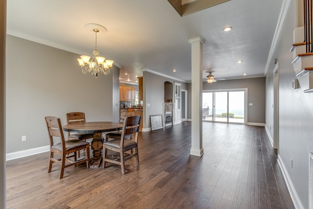 dining area featuring ornamental molding, ceiling fan with notable chandelier, and dark wood-type flooring