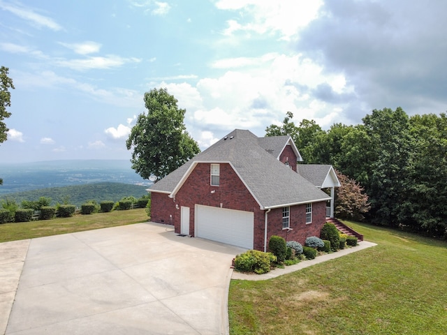 view of home's exterior featuring a yard and a garage