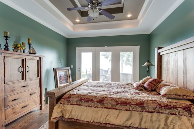 bedroom with a raised ceiling, access to outside, ceiling fan, and dark wood-type flooring