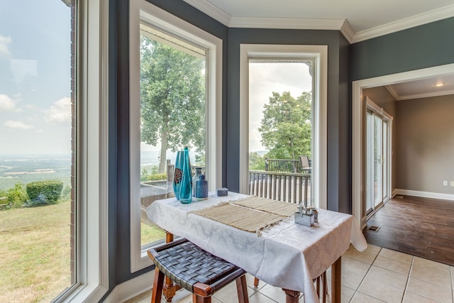 tiled dining room with ornamental molding