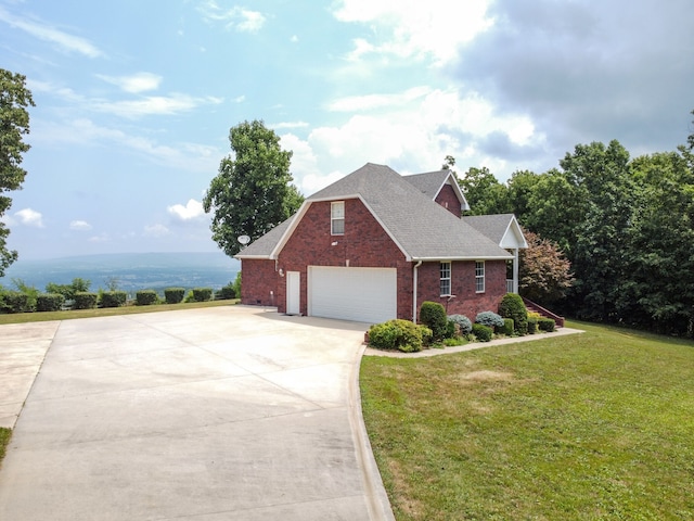 view of front property with a front yard and a garage