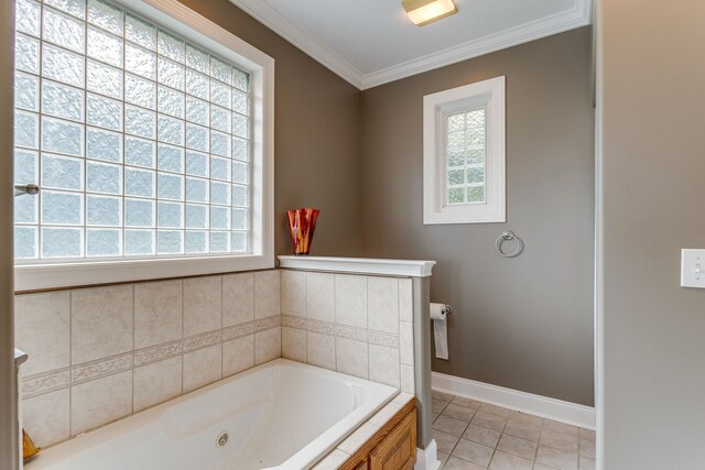 bathroom featuring a bath to relax in, tile floors, and ornamental molding