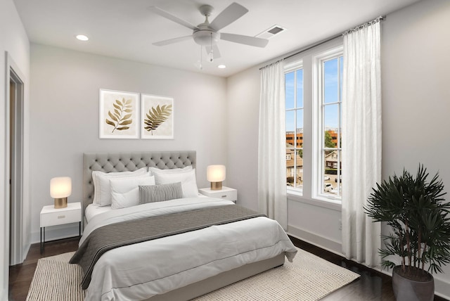 bedroom featuring ceiling fan and dark wood-type flooring