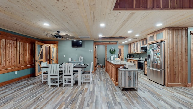 kitchen featuring light wood-type flooring, stainless steel appliances, ceiling fan, and wood ceiling