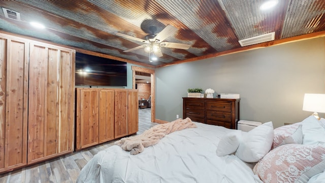 bedroom featuring ceiling fan and light wood-type flooring