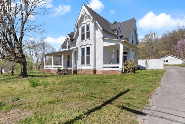 view of front of home featuring a front lawn and a porch