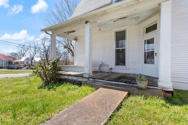 entrance to property featuring covered porch