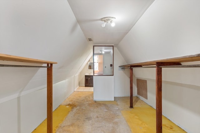 staircase featuring vaulted ceiling