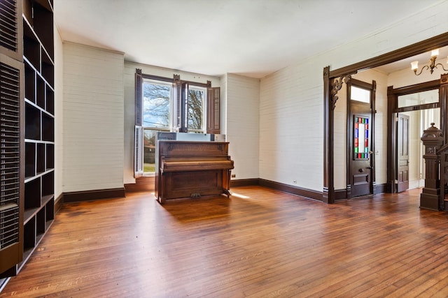 interior space featuring dark hardwood / wood-style flooring and a notable chandelier