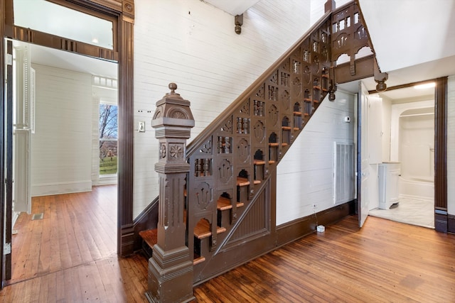 stairway with hardwood / wood-style flooring