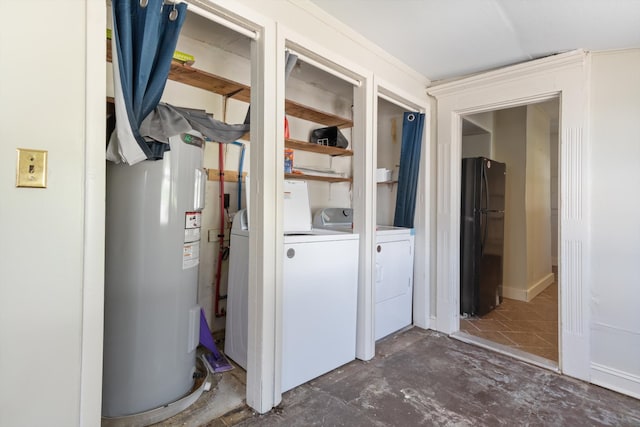 utility room with washer and dryer and water heater