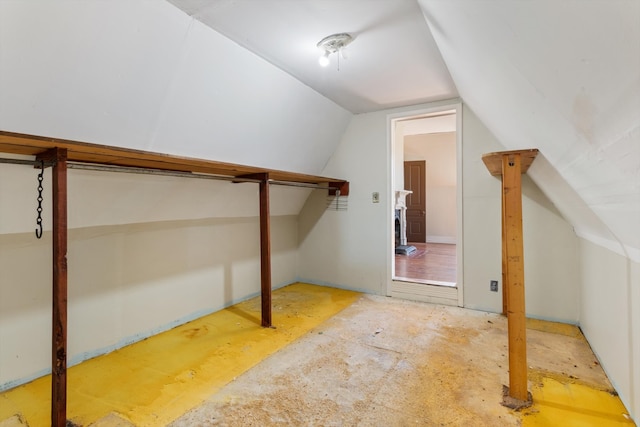 walk in closet featuring lofted ceiling