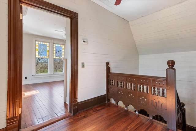 bedroom with vaulted ceiling, ceiling fan, and dark wood-type flooring