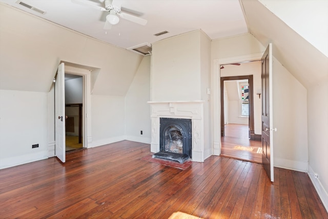 unfurnished living room with lofted ceiling, ceiling fan, and dark hardwood / wood-style floors