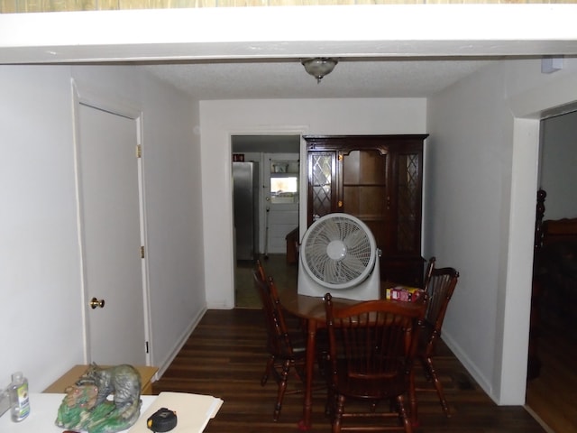 dining space with dark hardwood / wood-style flooring