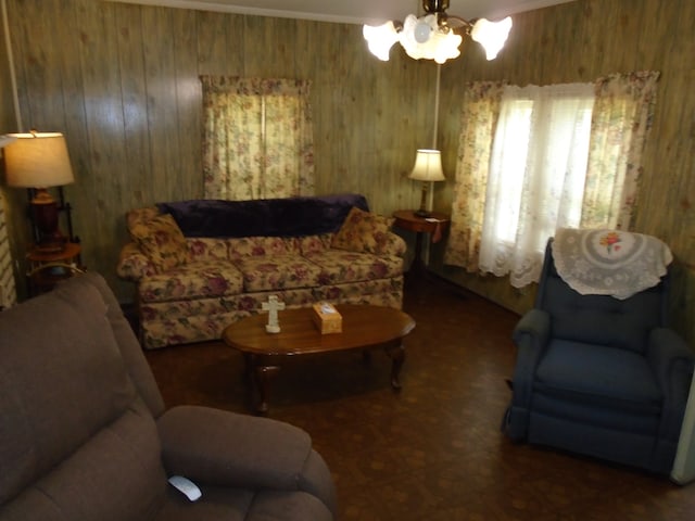 living room with wooden walls and a chandelier