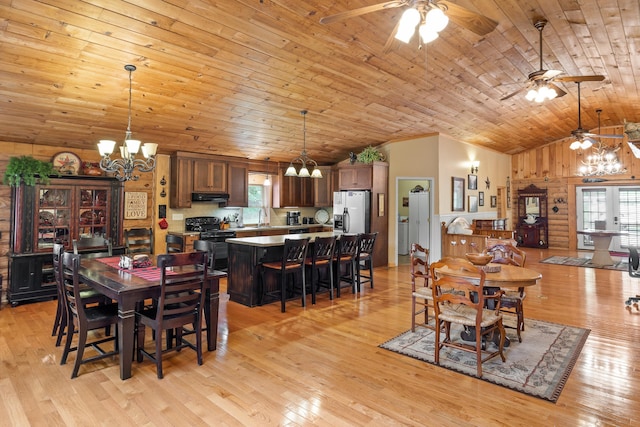 dining space with plenty of natural light, light wood-type flooring, and wood ceiling