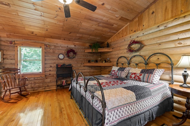 bedroom with lofted ceiling, wooden ceiling, and light wood finished floors