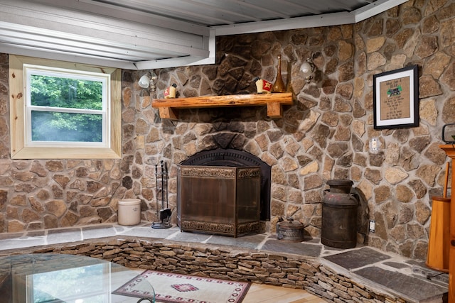 details featuring a fireplace and wood finished floors