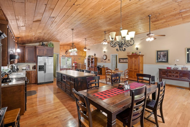 dining space featuring light wood-style floors, wooden ceiling, vaulted ceiling, and ceiling fan with notable chandelier