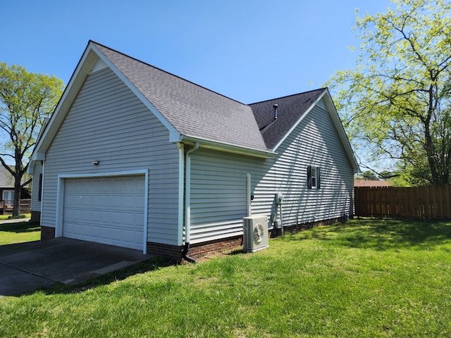 view of property exterior featuring a lawn, central AC, and a garage