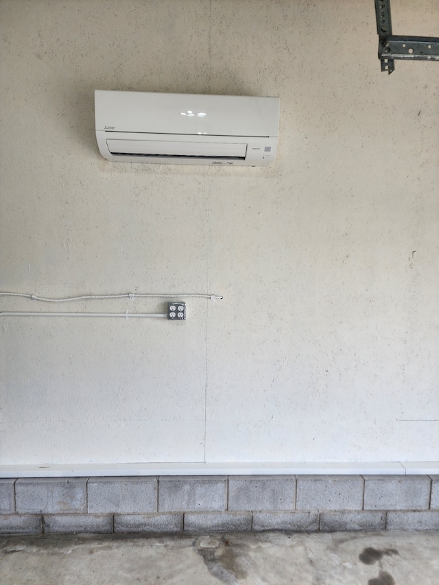 interior details with a wall mounted air conditioner