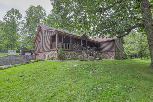 rear view of property with a lawn