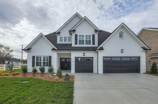 view of front facade with a front lawn and a garage