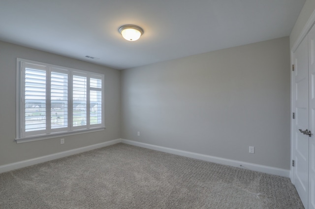 view of carpeted spare room