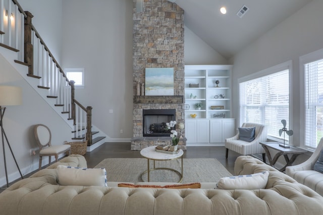 living room with high vaulted ceiling, dark wood-type flooring, and a fireplace